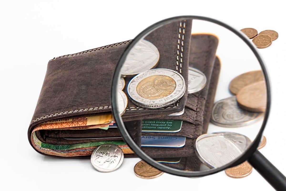 wallet, coins, magnifying glass